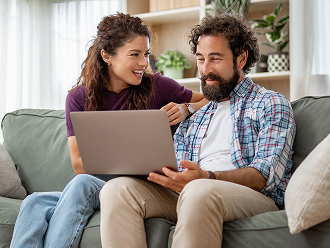 Couple using a laptop