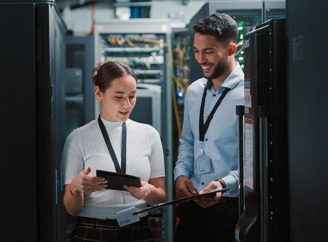 IT and security team reviewing a server room